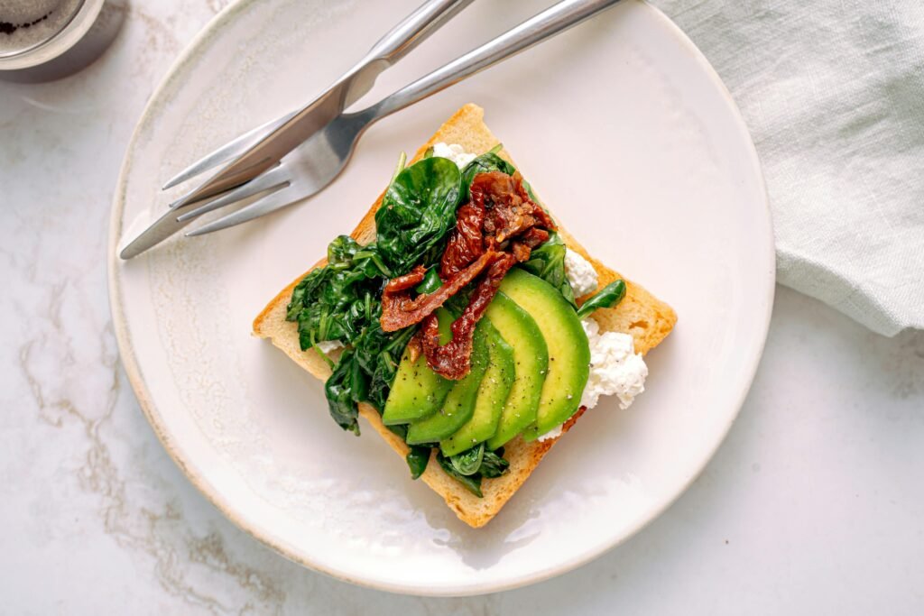 pexels-photo-5588983-5588983 Delicious Avocado Toast on White Ceramic Plate